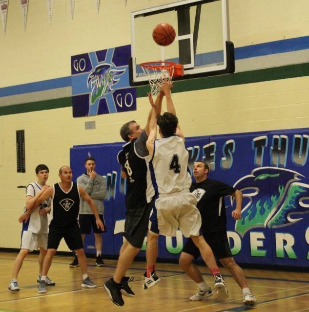 Students from Twin Lakes Secondary School battle against a team of Twin Lakes teachers and OPP officers in a charity game at the school. Contributed photo