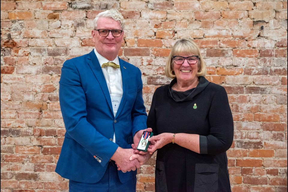 Former Orillia Mayor Steve Clarke was presented with the King Charles III Coronation Commemorative Medal on Wednesday evening. From left are Clarke and Ontario Senator Gwen Boniface. 