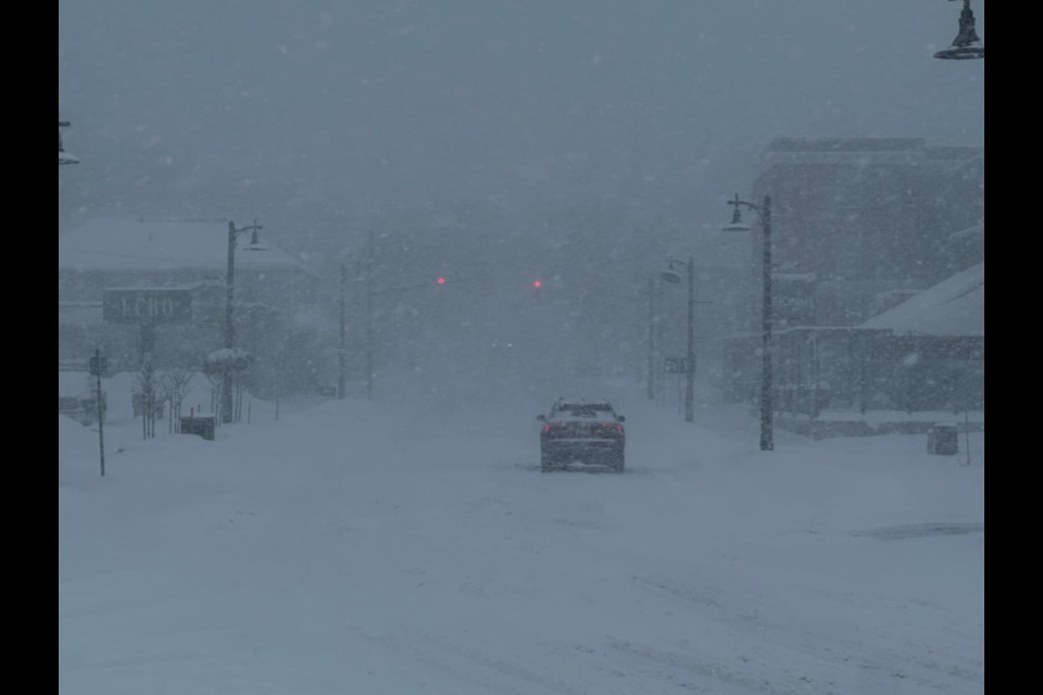 Drivers on Mississaga Street faced nearly white-out conditions amid heavy snow squalls around the lunch hour in Orillia Thursday. 
