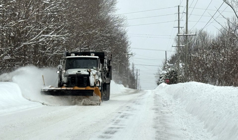 2025-02-18-gm-snow-plow-on-city-street-margot