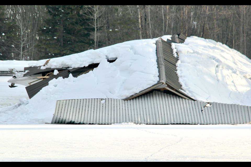 Here's a close up of the fully collapsed boathouse at Starport Marina. Two steel-roofed structures collapsed late Sunday night, neighbours say.