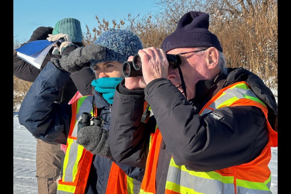 Local naturalist Bob Bowles, right, looks on with volunteers during the annual Christmas Bird Count last weekend.