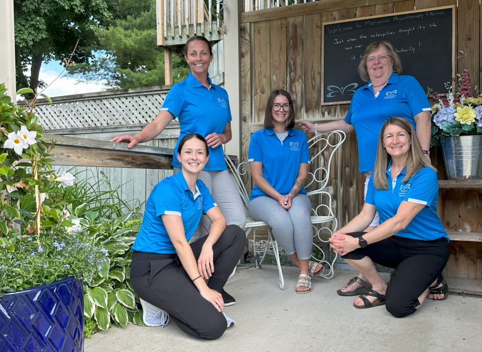 team-photo-matching-mariposa-shirts-butterfly-bench