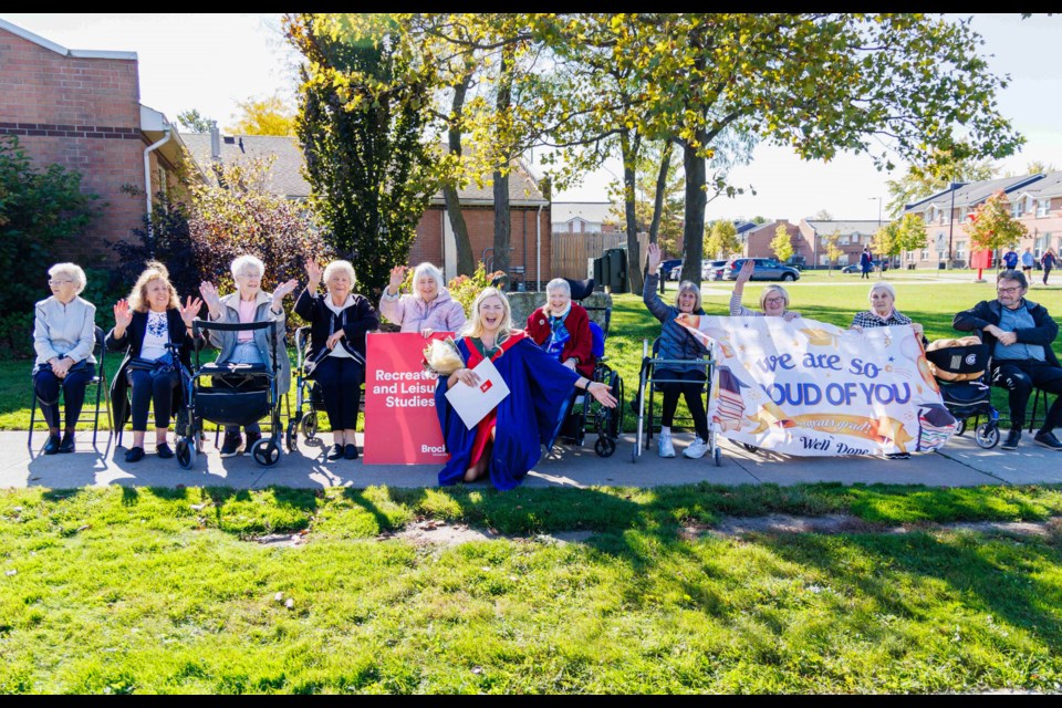 After crossing the stage at Brock University’s Fall Convocation with her Bachelor of Recreation and Leisure Studies, Sierra Witte walked outside to find a crowd of residents from Elgin Falls Retirement Community ready to celebrate her significant achievement