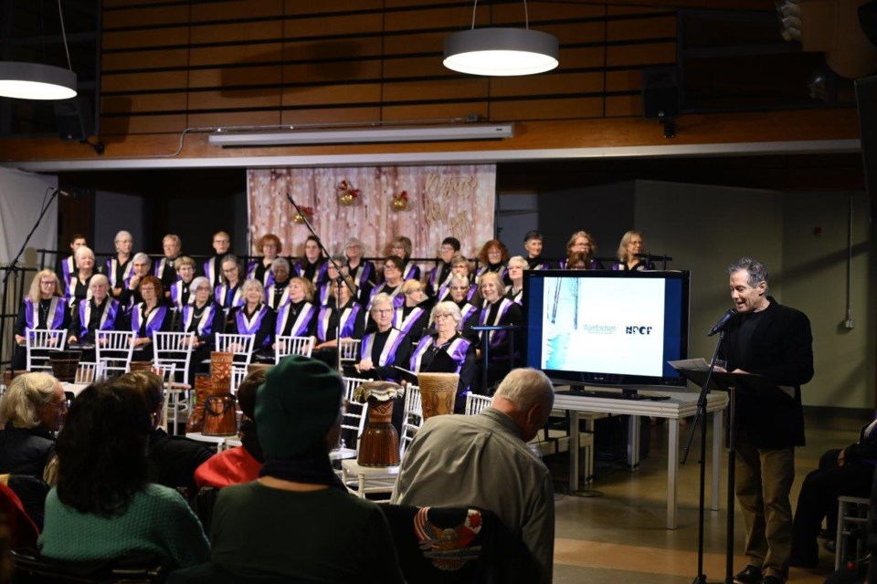 NPCF Board member Mike Balsom welcomes the audience, and gives opening remarks at the Winter Solstice concert