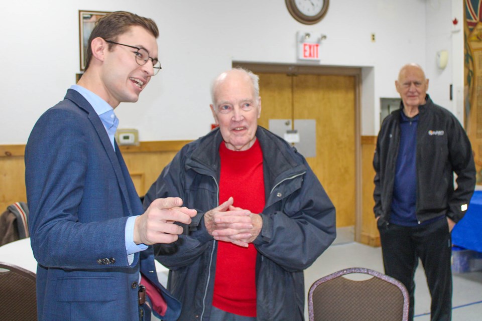 Sam Oosterhoff, left, talks to Douglas Johnson, of Fenwick, at the Niagara West MPP's annual New Year’s Levee at the Fonthill Legion, Sat. Jan 11.