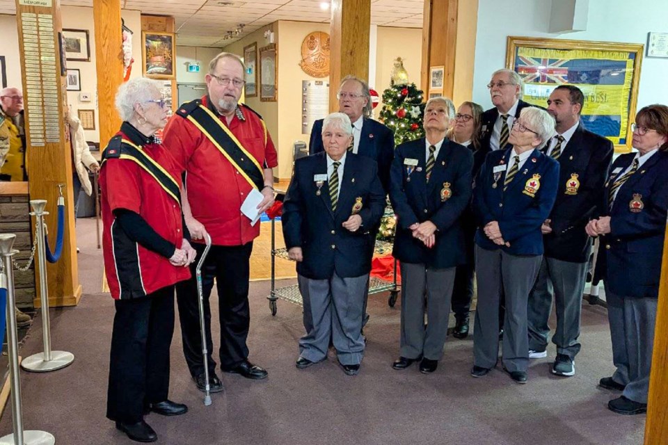 Sheila Turcotte, left, and Rick Allen of The Militaires Brass and Percussion Ensemble present a cheque for $1,5000 to Toni Russell, president of the Royal Canadian Legion, Br. 479 in Niagara Falls, along with the branch’s executive. The group, which is currently made up largely of seniors, is looking for new members.