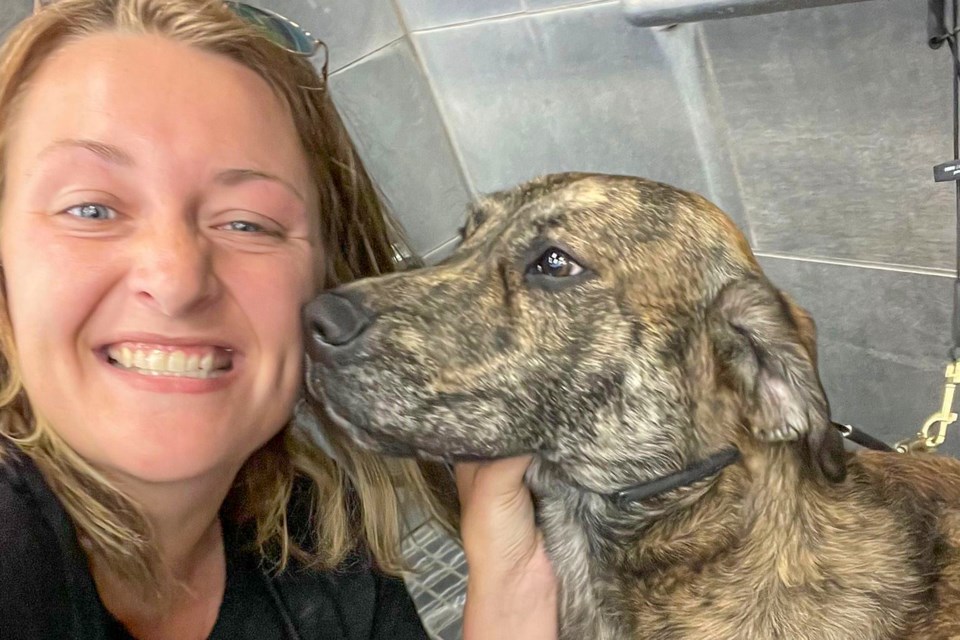 Cherylin Haus and her two-year-old Lab/Boxer mix Cola.