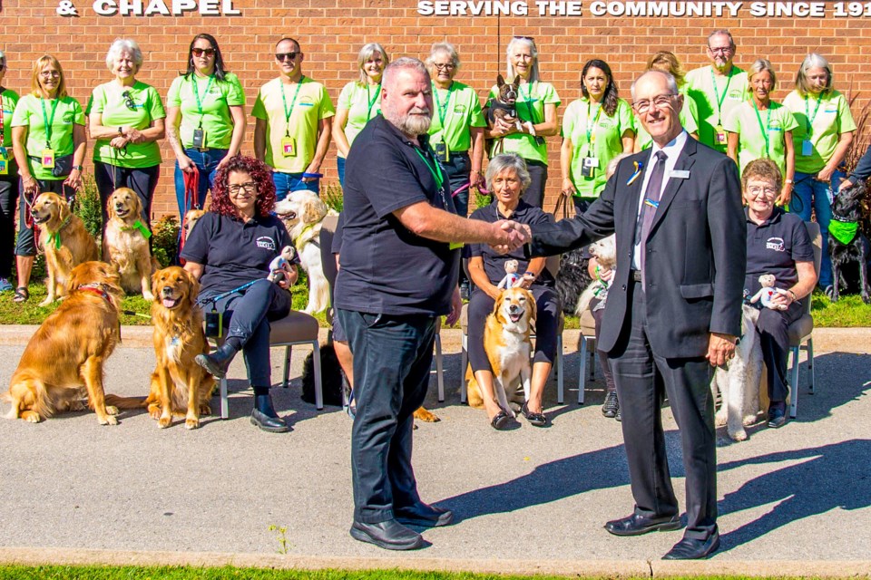 Therapy Tails Ontario CEO Stewart Hill, left, and George Darte, owner of the George Darte Funeral Home in St. Catharines, were joined my b staff and members of the Therapy Tails Ontario team for a launch of the new Paws for Comfort bereavement program on Oct. 7. The program is a partnership between Therapy Tails and the funeral home’s Darte Wellness Centre.
