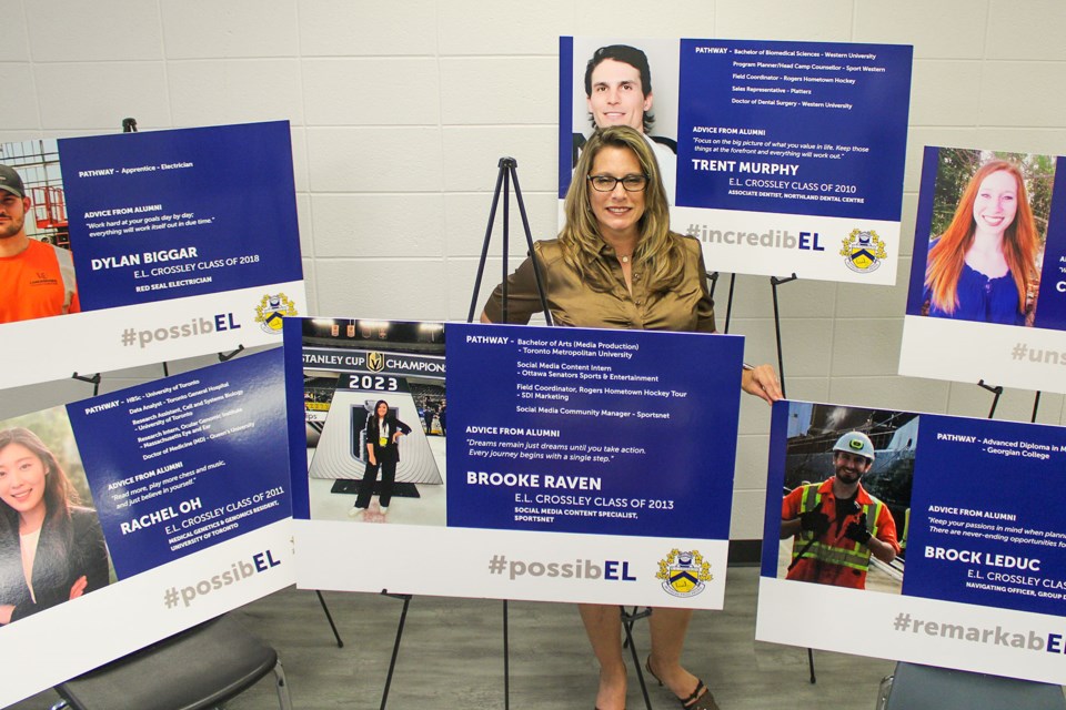 E.L. Crossley student services program lead Janet Cripps with some of the posters showing where past graduates of the Pelham school have taken their careers.