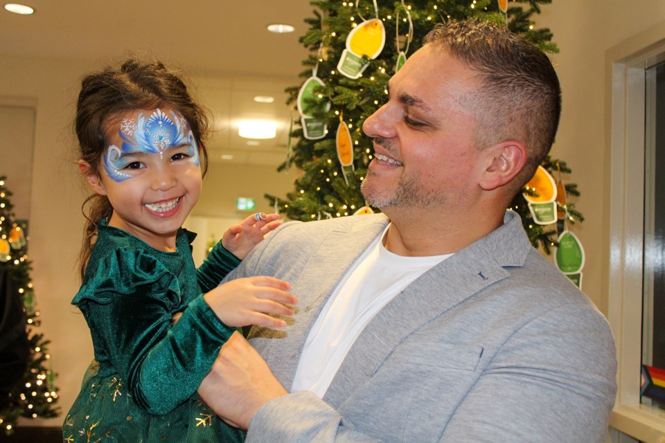 Realtor Nick Louras and his daughter, Luna, were all smiles at the Light Up Wellspring fundraising open house Thursday. The Louras Team (Royal LePage Real Estate) were title sponsors for the event.