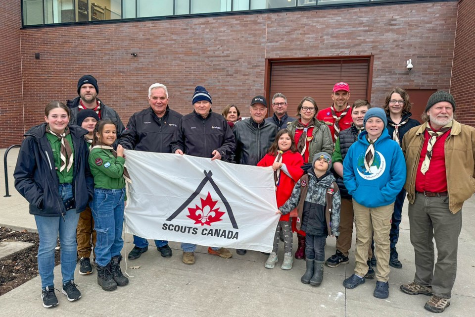 Mayor Junkin, centre, along with some Town Councillors helped raise the Scouts Canada flag at the MCC last Friday.
