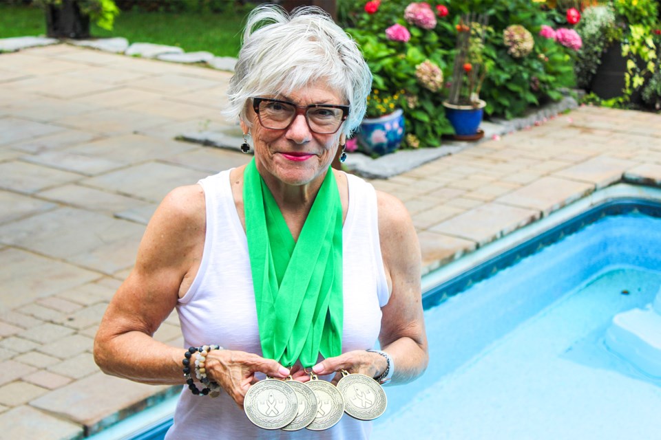 Jeanette Dempster shows off her collection of gold medals from swimming events at the Canadian Transplant Games in Ottawa recently. The Pelham resident underwent a heart transplant procedure back in 2018.