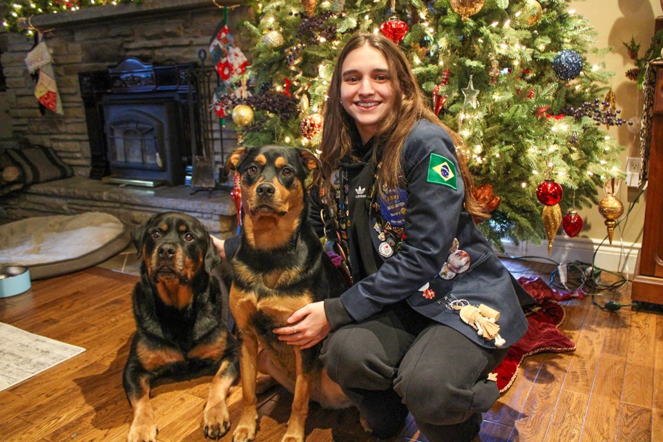 Maria Lepore Araujo, with Mike Taylor’s two dogs, Luther, far left, and Lyra. She is currently participating in Rotary International’s youth exchange program and will be living in Pelham until the end of the school year in June.