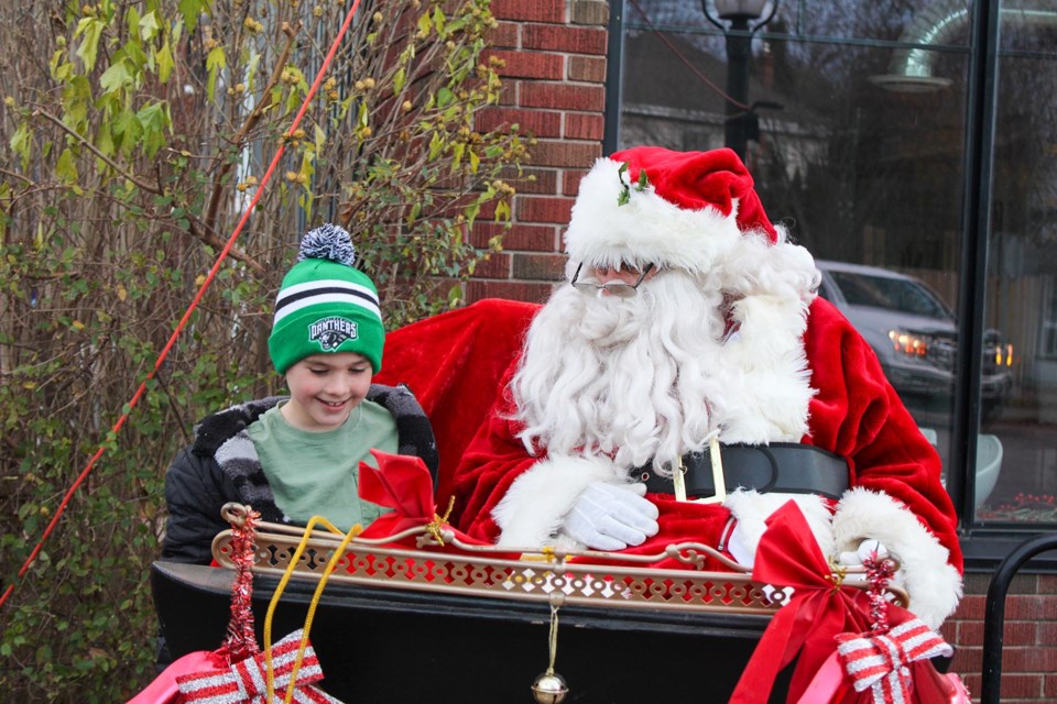 Greyson Bougie of Fenwick tells Santa what he wants for Christmas at the Fabulous Fenwick Lions’ annual Christmas Tree Lighting in downtown Fenwick on Saturday.