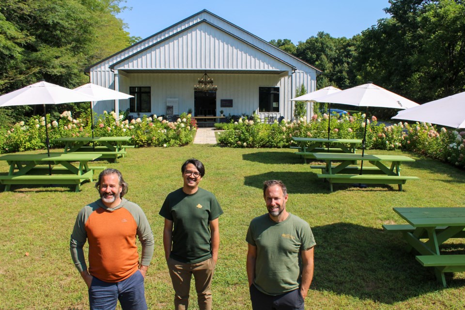 Sons and Daughters Winery owners, Geoff, left, and Anthony right, are joined by manager – and brother-in-law – Dan Sherrington outside the winery’s new building. While the winery held a soft opening last month and has been hosting tastings outdoors, there are still some finishing touches to be made on what will become a tasting centre and bistro. 