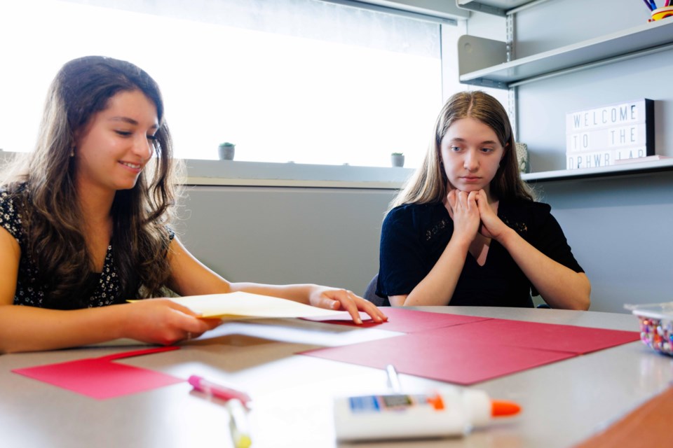 Teens Ava Pasto and Madeline Molnar learn about Brock’s perfectionism research while visiting the University’s Developmental Processes in Health and Well-being Lab