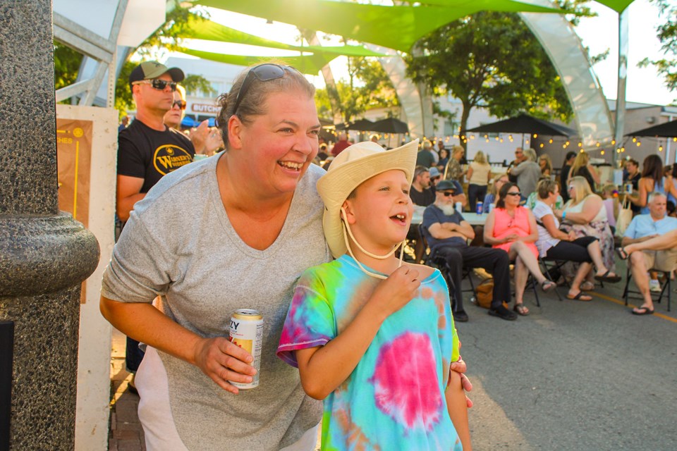 Stefanie Wurfel and Bryce Moore were having a good time Friday during Country Night at Pelham Summerfest.