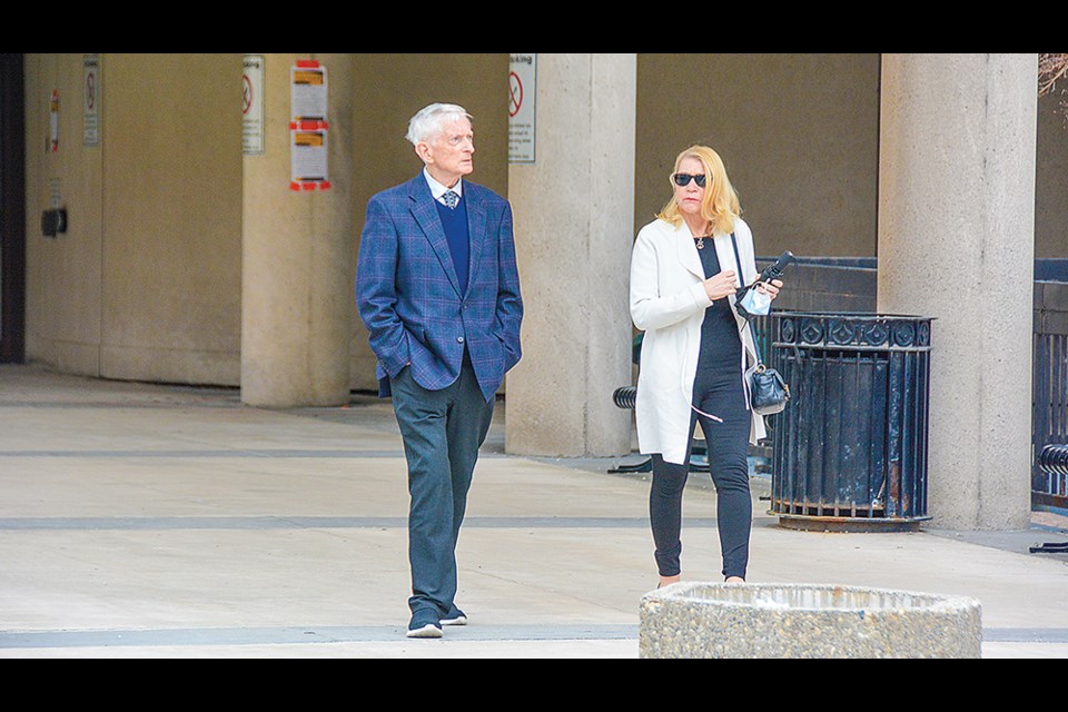 Charles Duncan and his partner, named in court as Barbara Vyrostko, depart the St. Catharines courthouse for a lunch break on April 8 2022, not to return. Duncan's lawyer cited a health issue as the reason for his client's absence.  / DON RICKERS