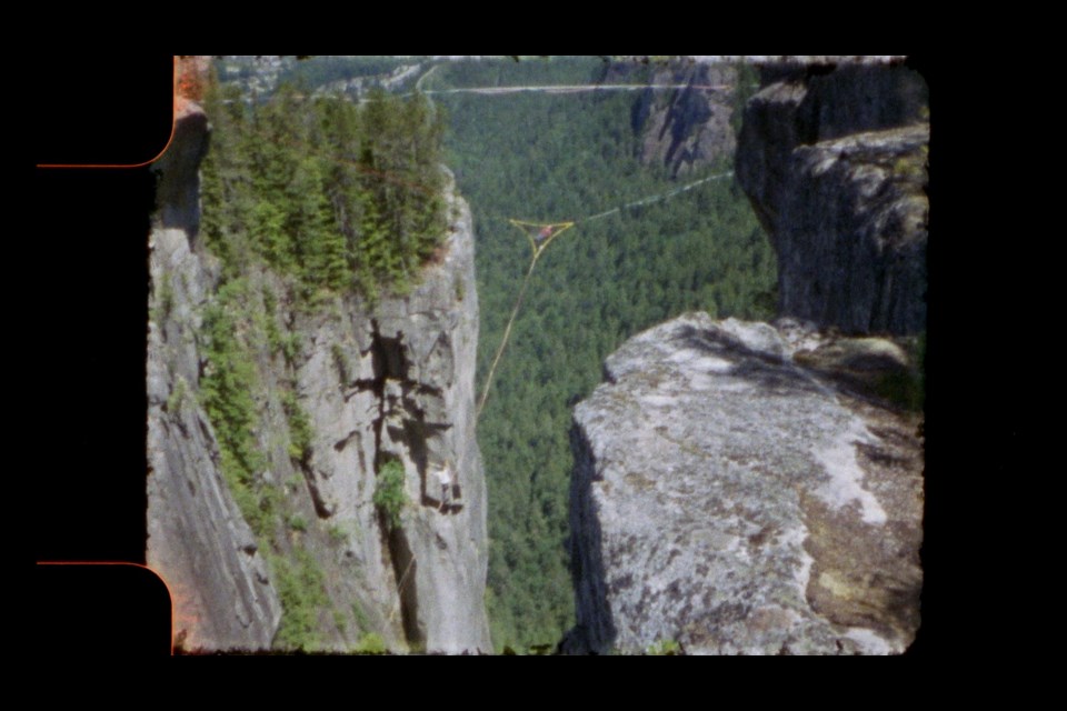 An image from Aidan Middleton's short film "A Line to Nowhere" depicting a three-pointed highline atop the Stawamus Chief.