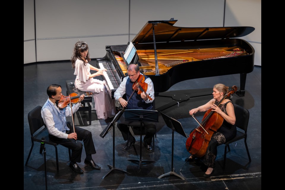 The Victoria Piano Quartet performs onstage.