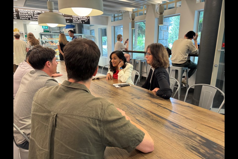 Minister Anita Anand and member of Parliament Patrick Weiler talking with some of Whistler's business community July 22, 2024 at Alta Café