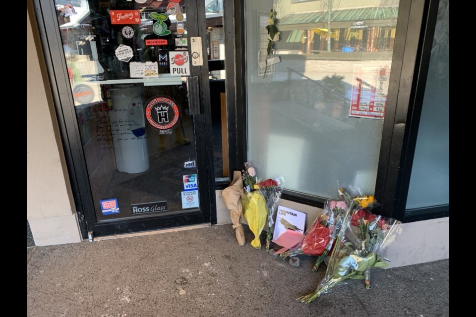 Flowers left at the shop Koehler owned, 2 Guys with Pipes, following his March 8, 2020 death. 