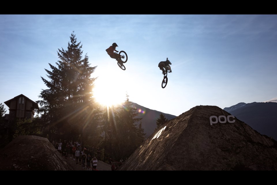 Two airborne riders silhouetted by sunlight at the 2024 Whistler Whip-off.