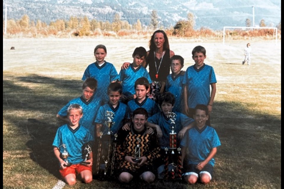 Anne Crowley (back row, middle) with one of her many former PYSA soccer teams.