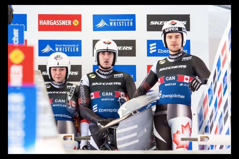 Beattie Podulsky (left), Devin Wardrope (middle) and Cole Zajanski ready to race at the Luge World Championships in Whistler on Feb. 6, 2025.