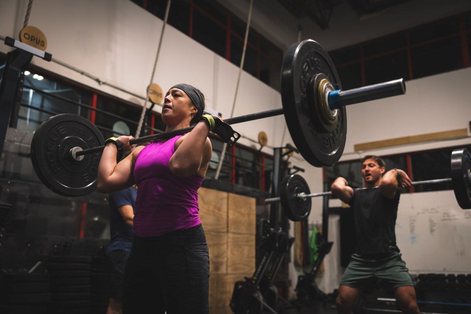 Opus Athletics regular and ex-professional freeskier Crystal-Rose Lee executes a power clean.