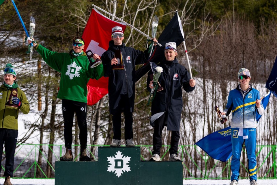 Joe Davies (middle) stands atop the men's 20-kilometre podium at the 2025 NCAA Skiing Championship. 