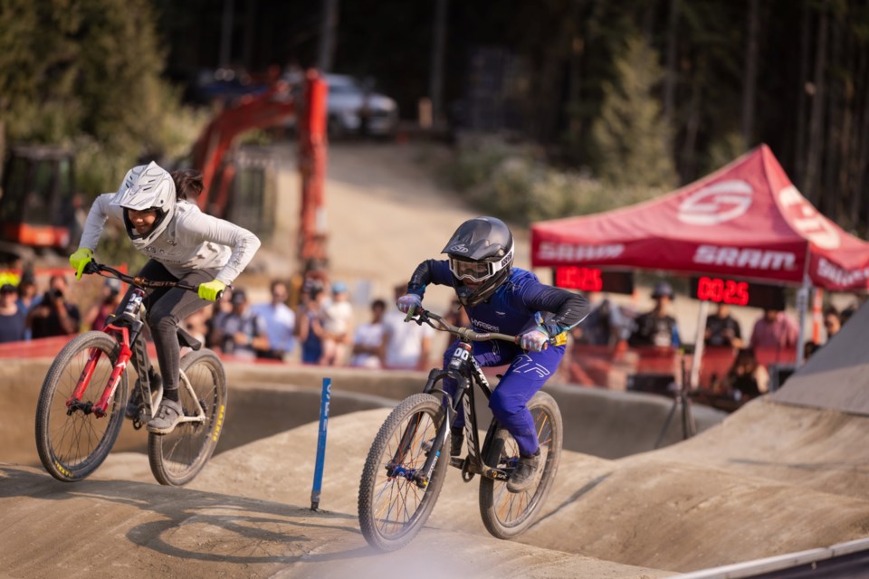 Jordy Scott (right) carves to gold against Kialani Hines at the 2024 Whistler Pump Track Challenge.