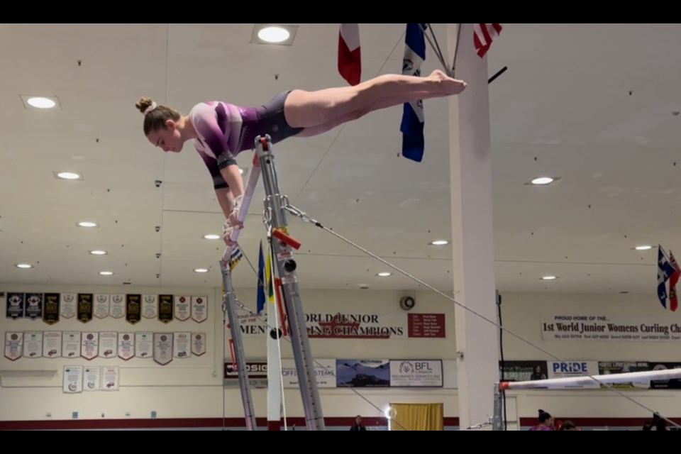 Kirra Douglas amidst her bronze-medal bar routine at the 2024 Ogopogo Spirit of the Lake Invitational.