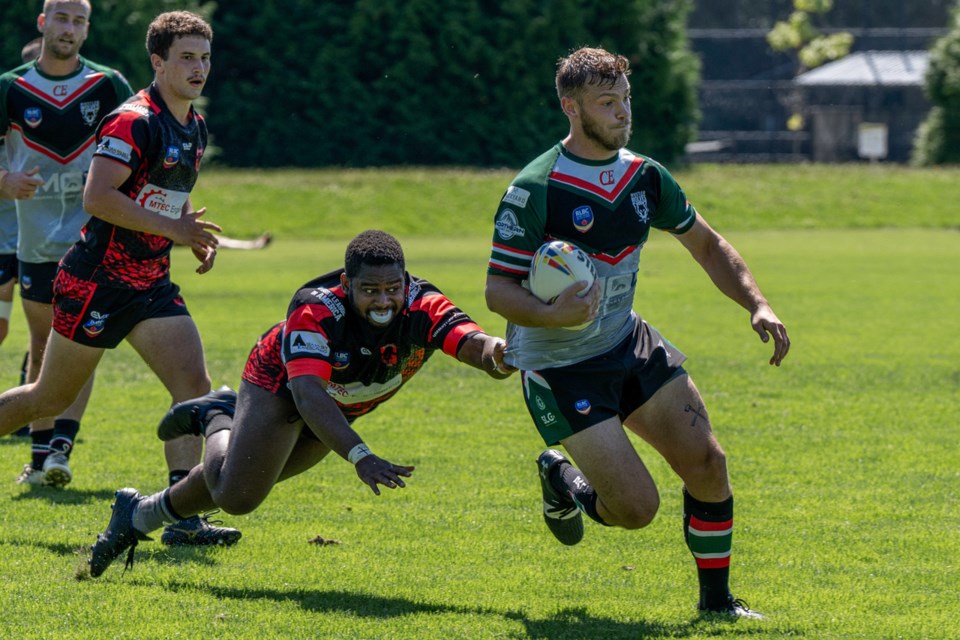 Ryan Ketler of the Whistler Wolves carries the ball at the 2024 RLBC Grand Final.