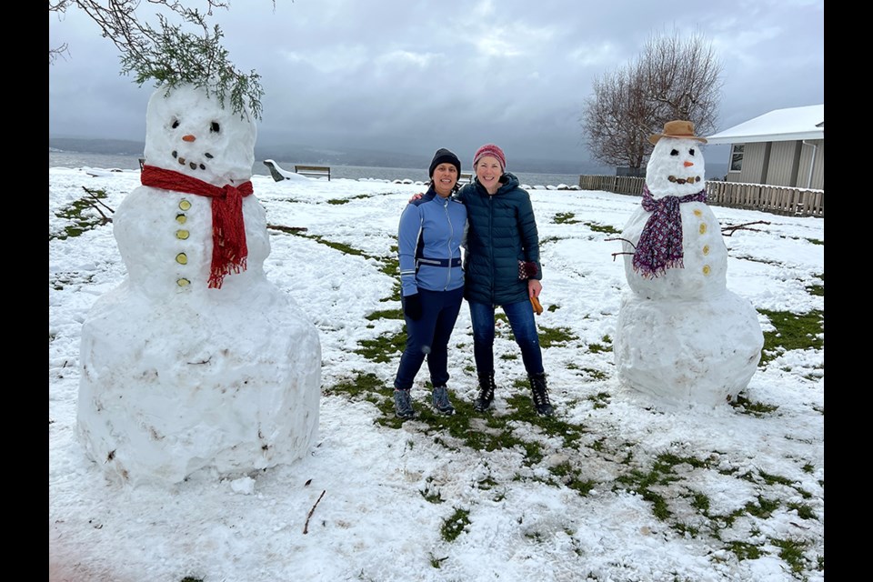 CONTEST WINNER: Jaspreet Soor [left] and Anne Baker were part of the crew that created these two snow persons at Grief Point Park.