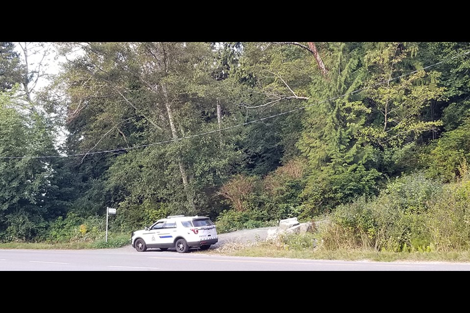 An RCMP vehicle at the entrance to the switchback trail on the Wildwood side of the bridge that crosses Powell River/Powell Lake. The trail is temporarily closed due to an aggressive bear in the area.