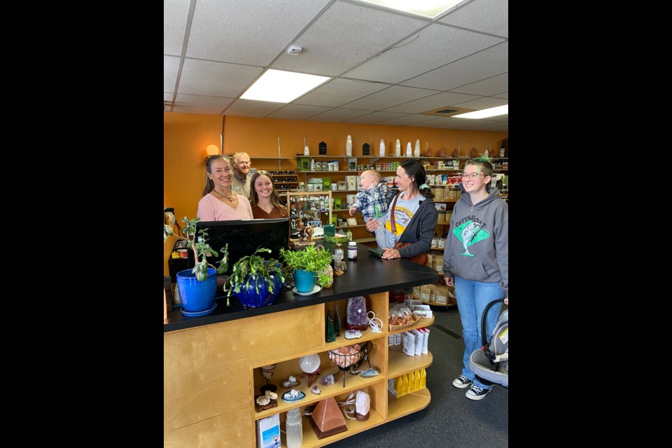 CELEBRATING HEALTH: Kelly's Health Shop staff members [from left] Kelly Doyle, Kevin Mostad and Maria Kondra behind the counter and ready to serve customers at the shop located on Marine Avenue.
