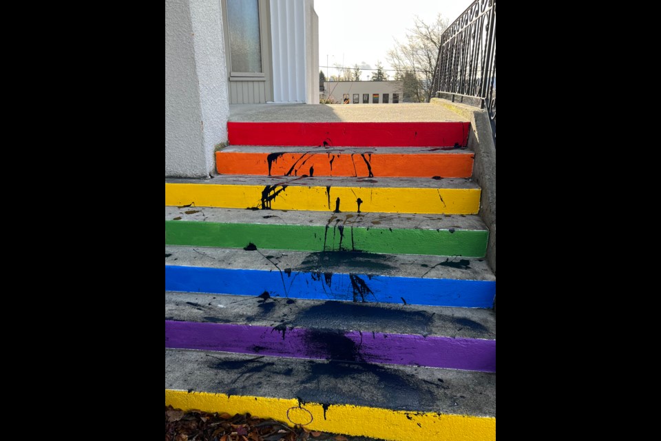 BLACK PAINT:  Powell River United Church members noticed some fresh black paint splattered on the church stairs, Wednesday, November 22, after 10 am. A rainbow design was painted on the stairs last spring by qathet Pride youth group. Brian Walker, a church member and volunteer building maintenance assistant, helped clean up the paint.
