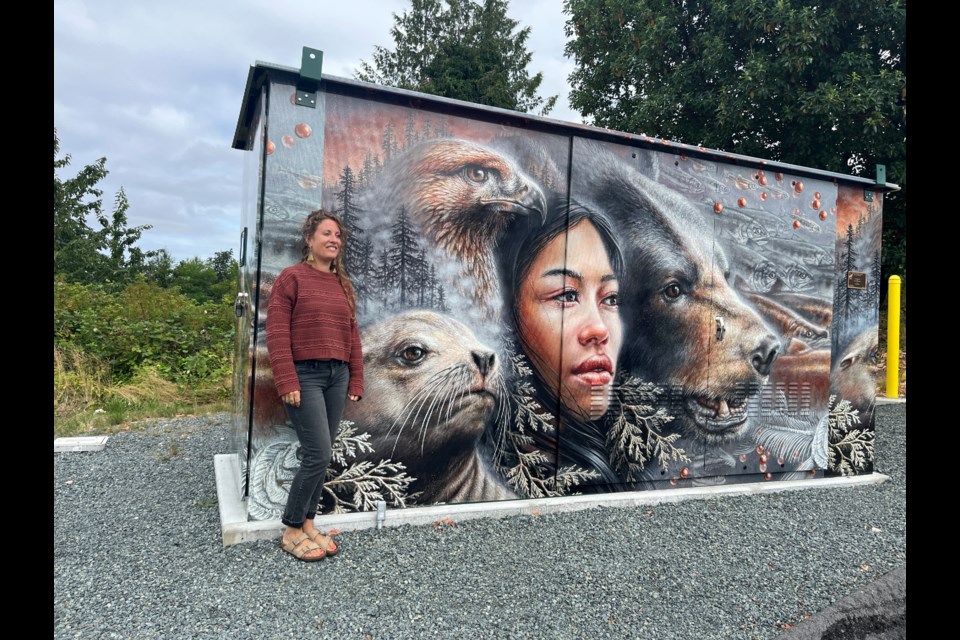 ONE WITH NATURE: Artist Autumn Skye was chosen by the Townsite Ratepayers Society to have her artwork wrapped around a water box at Larch Avenue and Hemlock Street.
