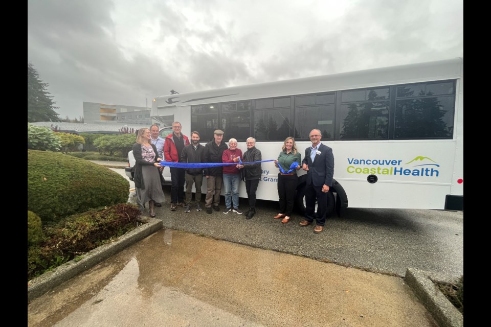 RIBBON CUTTING: Powell River Health-Care Auxiliary, Vancouver Coastal Health and City of Powell River representatives gathered at Evergreen Extended Care on Friday, October 18, to celebrate a new bus for the adult daycare program.
