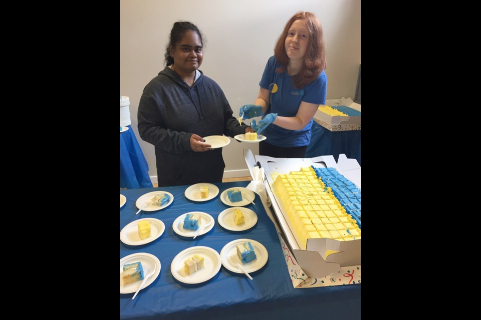 DELICIOUS DESSERT: Brooks Interactors Bea Salvador [left] and Kaylyn Gleave helped at the Ukrainian Dinner.