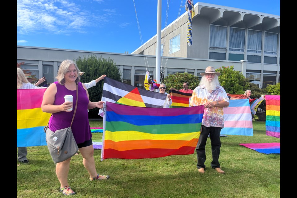 PROGRESS PRIDE: Powell River city councillors Cindy Elliott and George Doubt joined community members and qathet Pride Society to raise a Progress Pride flag at city hall on Friday, August 1.
