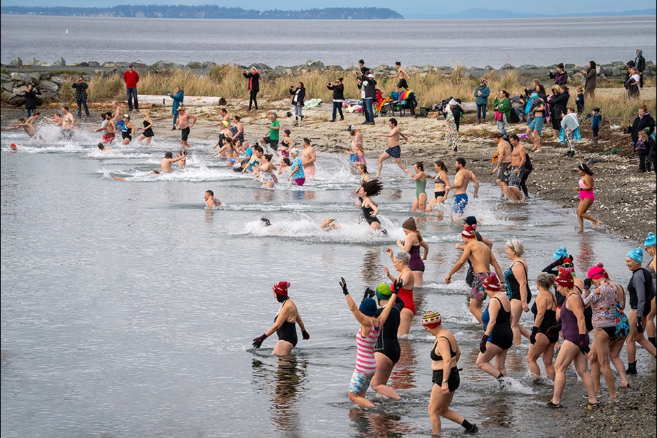 DARING DIPPERS: The annual polar bear swim in the qathet region took place at Willingdon Beach on January 1, 2024.