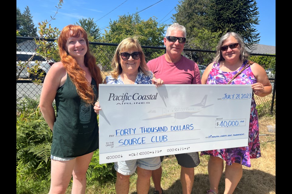 SOURCE DONATION: The Source Club Society, a prevocational rehabilitation program and clubhouse for people struggling with mental illness, hosted an annual summer barbecue Friday, July 21. [From left] Source Club member Amber Schindel, Source Club board chair Maggie Hathaway, Pacific Coastal Airlines president Quentin Smith and current Powell River city councillor Cindy Elliott, who was in the role of acting mayor at the event in the absence of mayor Ron Woznow.
