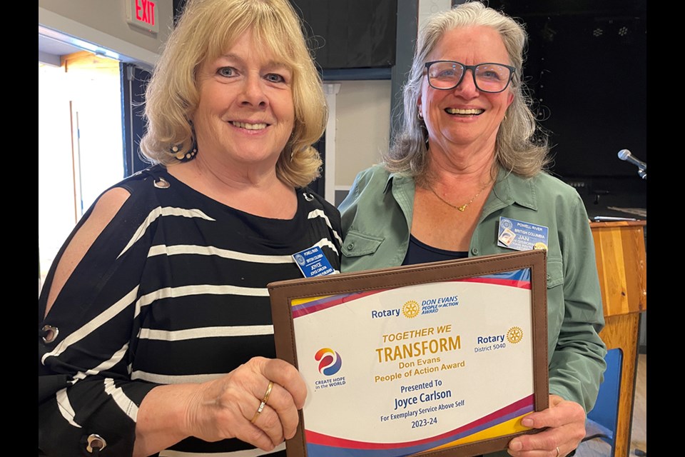 Rotarian Joyce Carlson [left] receives her People of Action award from Rotary Club of Powell River president Jan Gisborne.
