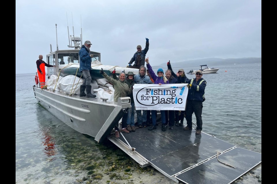 SHORELINE CLEANUP: Savary Island is said to have some of the warmest waters north of Mexico. With 18 kilometres of white sandy beaches one wouldn't guess that they are awash in plastic pollution. Catherine Ostler [middle, with turquoise toque] is part of a nonprofit called Fishing for Plastic and organized this year's cleanup, filling a boat with collected plastic that will be recycled or reused, if it can be.