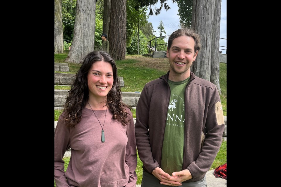 EXPANDED  PROGRAMMING: Candice Seagull [left], facilitator of nature connections program, and Kester Reid, co-founder and lead instructor of Fianna Wilderness School, celebrated with an end of school year potluck with students and parents at Willingdon Beach. Expanded programming begins in September 2023.
