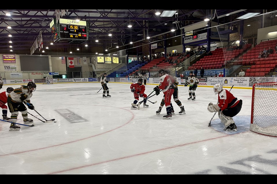 Braedyn Louie fights off a defender before sending a shot toward the Cowichan Valley net in a U18 hockey game at Hap Parker Arena on October 16.
