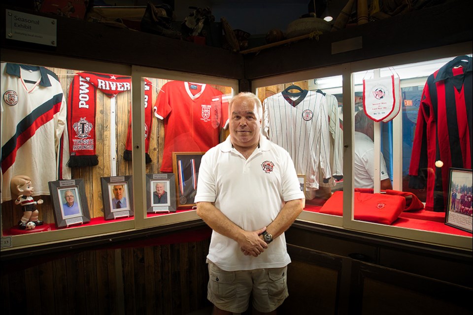 LASTING LEGACY: Powell River Villa president Dave McLennan recently stopped by qathet Museum and Archives, where a current display features photographs and artifacts that highlight the soccer club’s history.